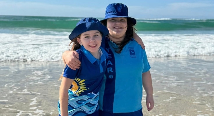 students enjoying their visit to a local beach