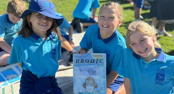 Students enjoying reading a story together at our Simultaneous Story Time event