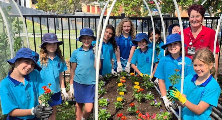 Group photo of students particiapting in lunch time garden club